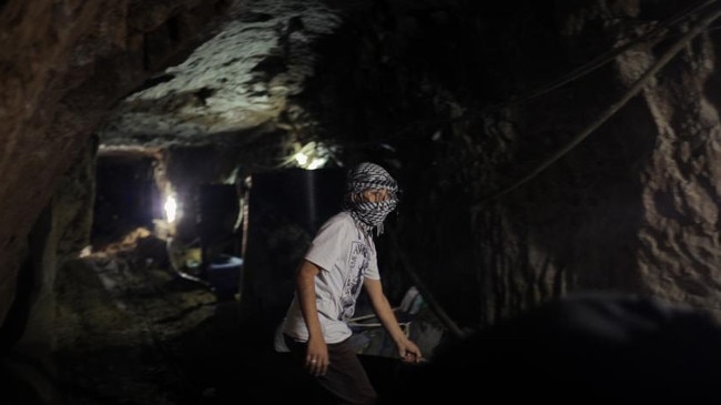 Smuggler Mohamed Alhwani in a tunnel near the Egyptian border in April 2013. The network of tunnels is also a lifeline for Gaza, bringing in an estimated 30 per cent of all goods that circumvent the blockade imposed by Israel Picture: Ahmed Deeb