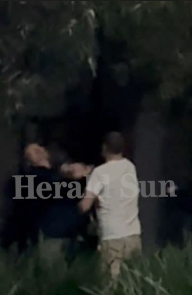Carey is filmed in a heated exchange with the man.