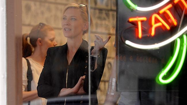 Blanchett and Adams inside the tattoo parlour. Picture: NPG.