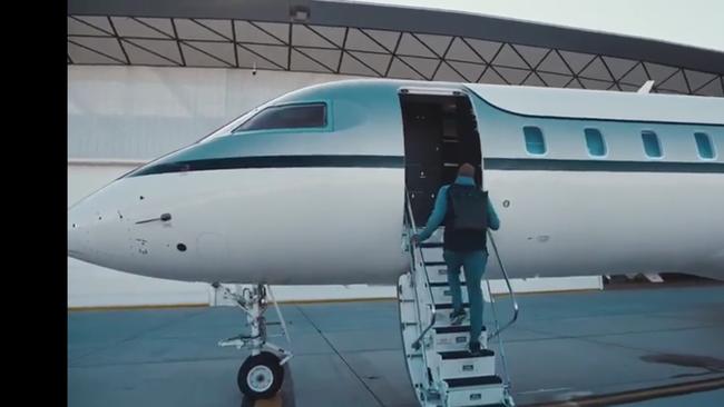 Kobe Bryant boards his private jet in Melbourne.