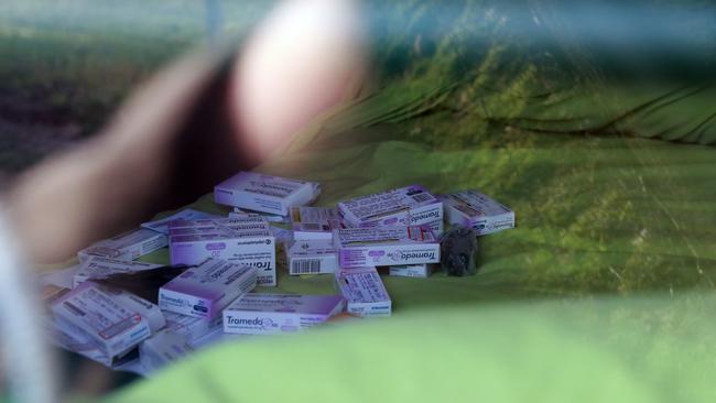 Boxes of opiod drug Tramedo pictured on a bed inside the house.