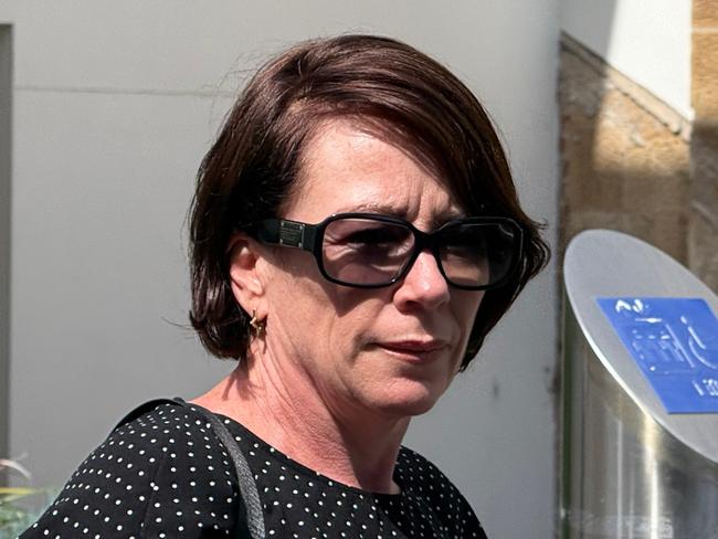 Jennifer Anne Frew leaving Wollongong Local Court on Wednesday December 4 2024 after pleading guilty to break and enter and dishonestly obtaining financial advantage by deception. Picture: Dylan Arvela