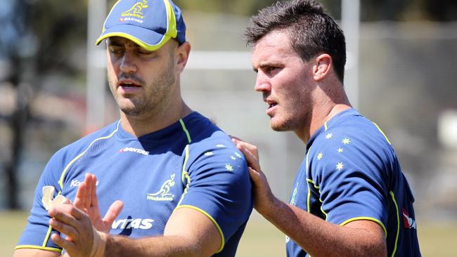 Kane Douglas chats to Nathan Sharpe during a Wallabies training camp last year.