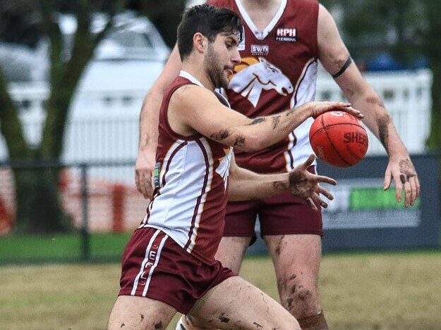 Jayson Fabris gets the ball on his boot. Picture: Davis Harrigan