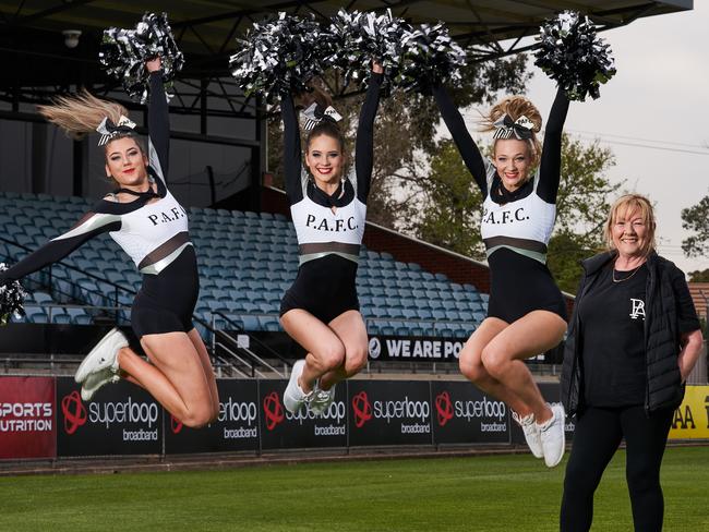 Cheerleaders, Gabriella Ward, Abbey Harby and Zenya Lodenstein with choreographer, Gaynor Palmer pose for a picture at Port Adelaide Football Club in Alberton, after being allowed by the SANFL to cheer before Sunday's grand-final, Thursday, Sept. 19, 2019. Picture: MATT LOXTON