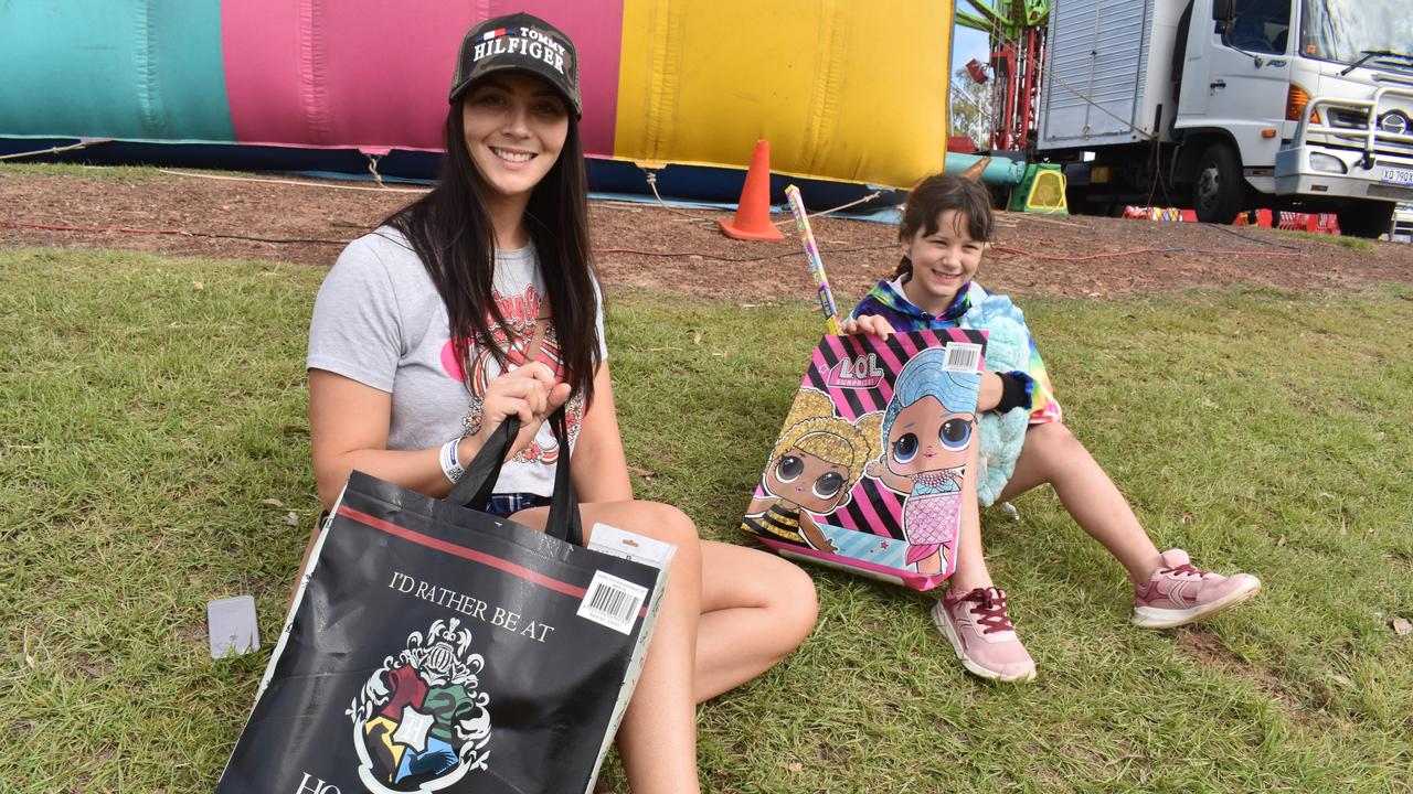 Cassie and Summer Richards from Hervey Bay show off the show bags they got from the Fraser Coast Ag Show. Photo: Stuart Fast