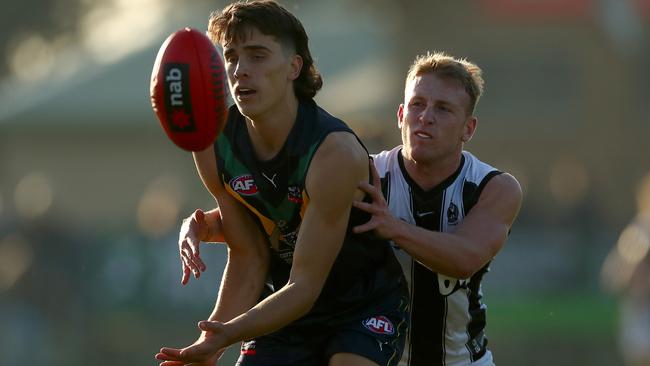 Luke Teal (left) in action for the AFL Academy. Picture: Kelly Defina/AFL Photos/Getty Images)