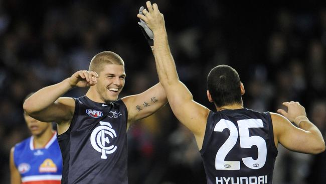 Cameron Cloke celebrates with Brendan Fevola.