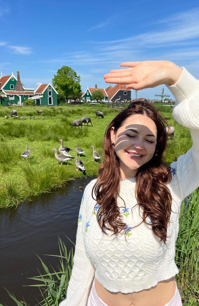 OnlyFans star Anna Paul, living her best life touring Paris and cycling around Amsterdam sampling cheese, oysters and champagne., “Living my fairy cottage life,” she posted