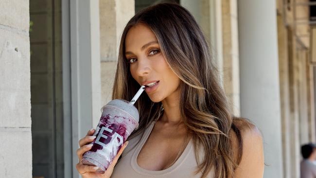 Nadia Bartel with her Nadia Bartel Violet Glow Smoothie at Green Cup. Pic: Dan Castano