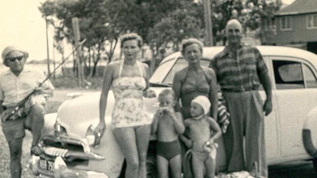 Spies on holiday: Vladimir Petrov with the fishing rod, Joan Doherty, Mark Doherty, Evdokia Petrov with Sue-Ellen Doherty, and an unidentified ASIO agent. Picture: Supplied