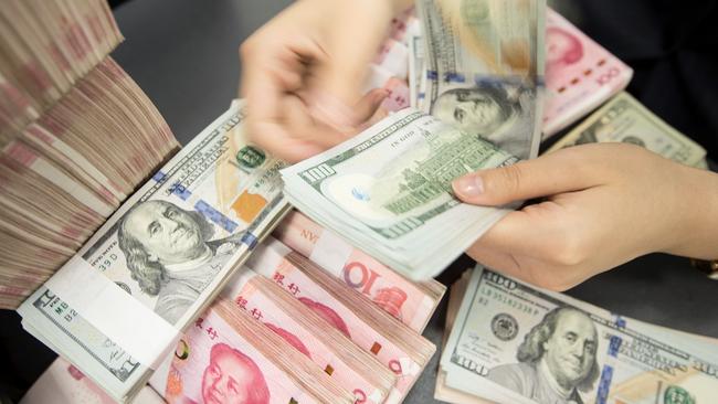 The US dollar’s dominance over the yuan on global markets boils down to trust and convertibility. Picture: AFP