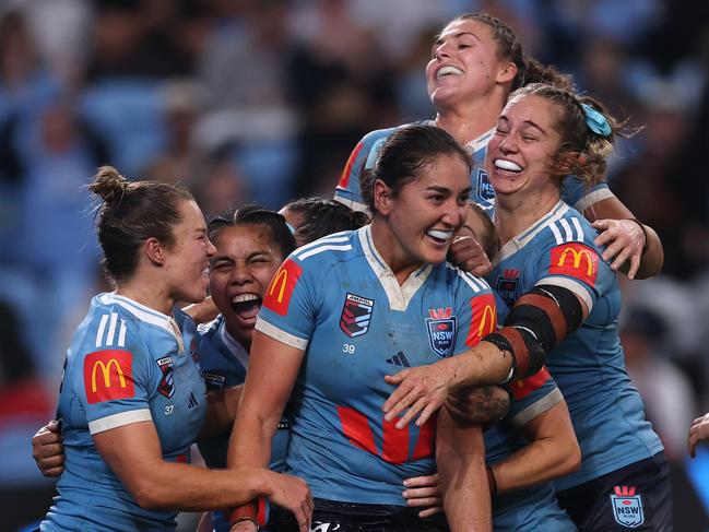 SYDNEY, AUSTRALIA - MAY 15: Olivia Kernick (L) of the Blues celebrates scoring a try with teammates during game two of the Women's State of Origin series between the New South Wales Blues and Queensland Maroons at Allianz Stadium on May 15, 2025 in Sydney, Australia. (Photo by Cameron Spencer/Getty Images)