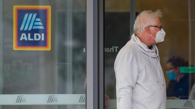 People wearing face masks in Aldi in Altona. Picture: Jay Town