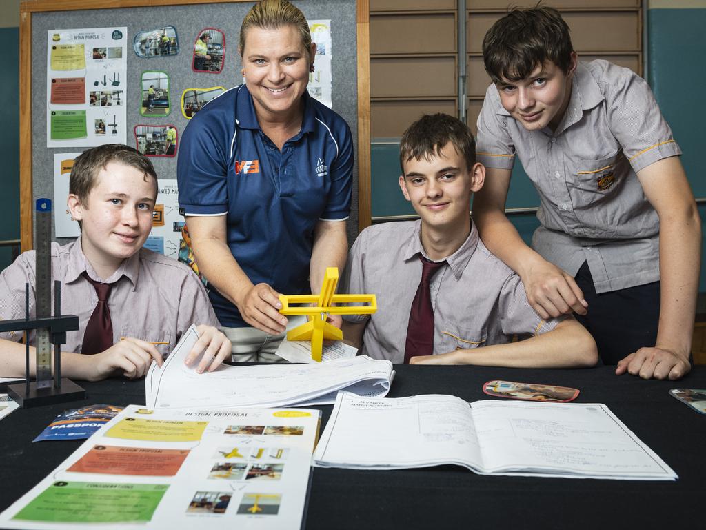 MFE general manager Louise McMahon discusses with Chinchilla State High School students Riley Wilson, Ethan Honnery and Reece Nicholls their project to bring efficiencies to metal manufacturing at the STEM advanced manufacturing Makers Empire schools showcase at The Salo Centre, St Ursula's College, Monday, November 4, 2024. Picture: Kevin Farmer