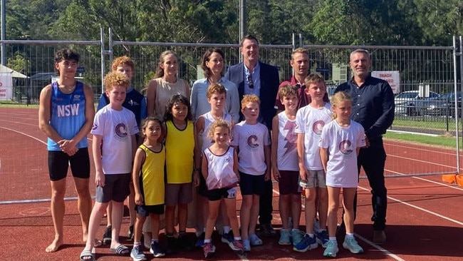 NSW MPs Jacqui Scruby (Pittwater) and Michael Regan (Wakehurst), with federal MP Sophie Scamps (Mackellar) and Manly Little Athletics president, Andrew Jauncey and Athletics NSW CEO, Christian Renford, with young athletes on the closed Sydney Academy of Sport athletics track. Picture: Supplied