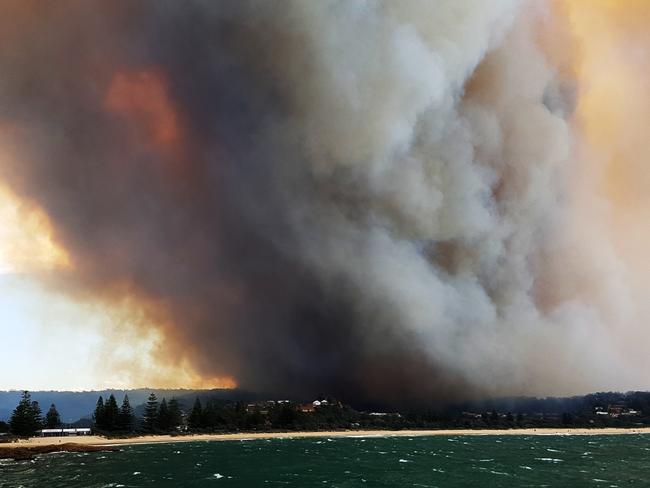 Firestorm ... The township of Tathra from its wharf. Picture: Katrina Walsh