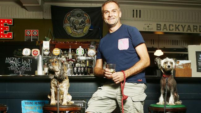 Mark Waldron with dogs Oscar and Blanche at the bar at the Erskineville Hotel. Picture: John Appleyard