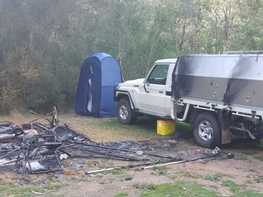 Russell Hill and Carol Clay's burnout campsite photographed by a camper near Dry River track at Billabong in the Wonnangatta Valley. Pic credit: ABC