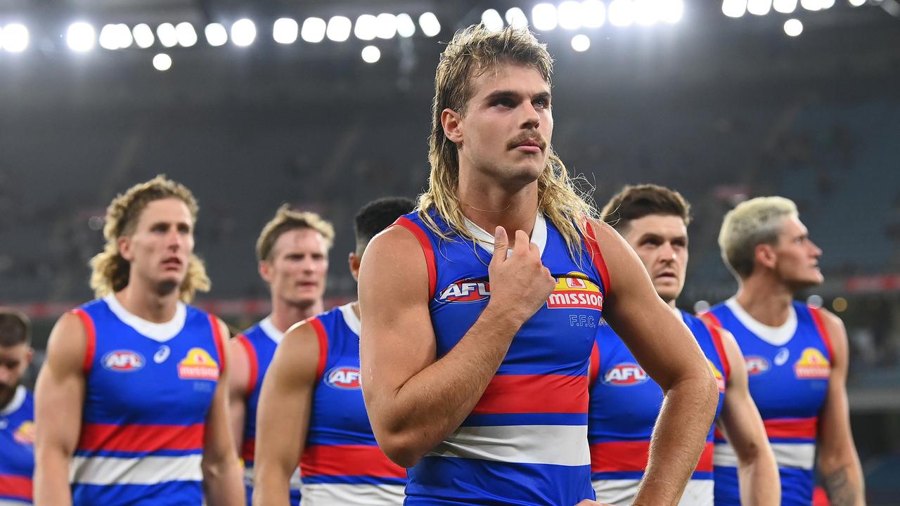 Bailey Smith trudges off the ground with his teammates after the loss. Picture: Quinn Rooney/Getty Images