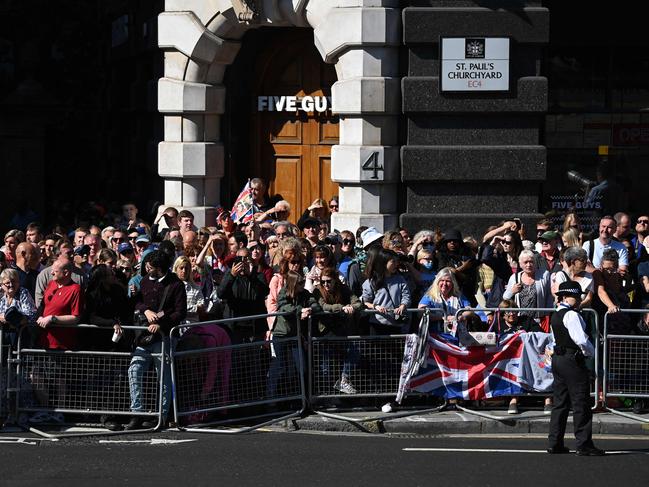 Thousands of onlookers have gathered outside St Paul's Cathedral in London. Picture: AFP