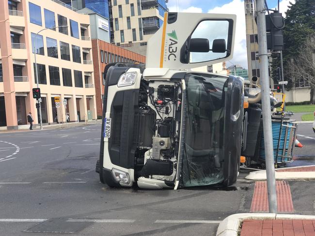 A truck has rolled on Hutt St and Pirie St while the driver escaped uninjured. Pic: 10 News First/Jase Kemp