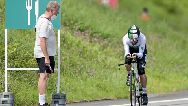 29 July 2021, Japan, Oyama: Cycling: Olympics, Oyama (22.10km), men, individual time trial at Fuji International Speedway. Patrick Moster, Sports Director of the BDR (German Cycling Federation), stands on the side of the track next to Azzedine Lagab from Algeria in action during the time trial. Photo: Sebastian Gollnow/dpa (Photo by Sebastian Gollnow/picture alliance via Getty Images)