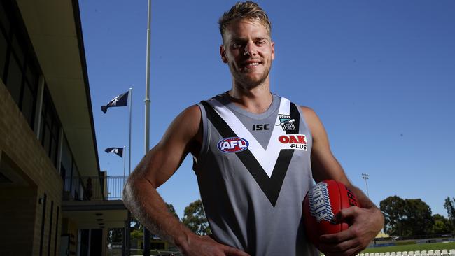 Jack Watts tries on his new colours. Picture: Sarah Reed