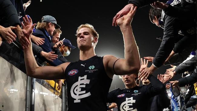 Tom De Koning celebrates with Blues fans after Carlton’s win over Essendon. Picture: Robert Cianflone/Getty Images