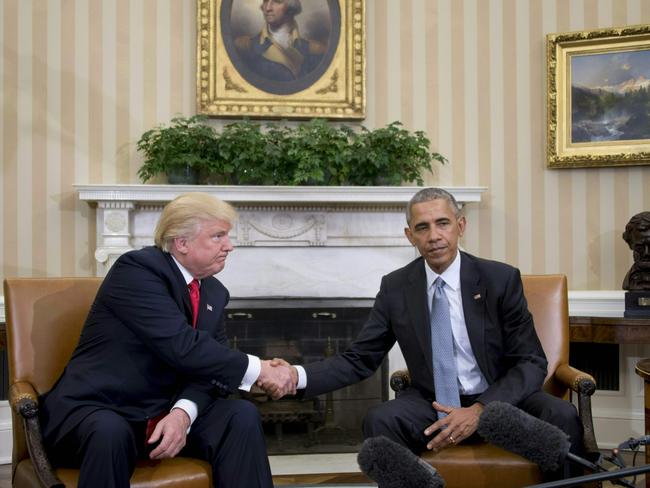 US President Barack Obama shakes hands with Republican President-elect Donald Trump in the Oval Office. Picture: JIM WATSON