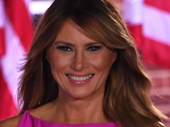 US First Lady Melania Trump and US President Donald Trump gestures to attendees during the third night of the Republican National Convention at Fort McHenry National Monument in Baltimore, Maryland, August 26, 2020. (Photo by SAUL LOEB / AFP)