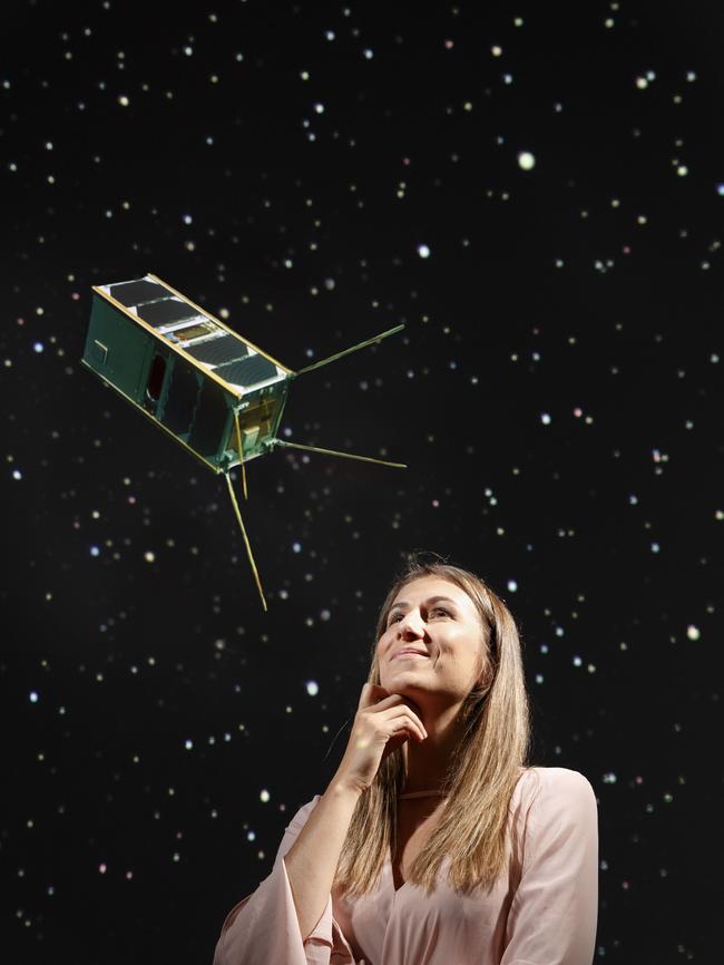 Flavia Tata Nardini with a superimposed image of the minaturised satellite she is creating. Picture: Matt Turner