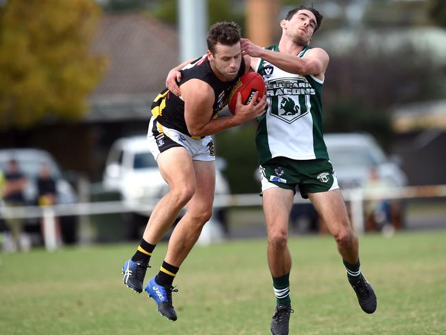 Lachlan Simpkin marks under close attention against Bell Park.