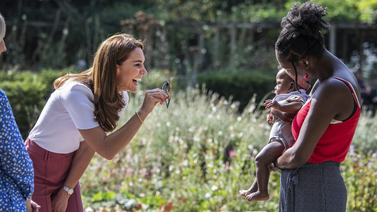 Kate Middleton meeting a mum and baby as she hears from families and key organisations about the ways in which peer support can help boost parent wellbeing. Picture: Jack Hill – WPA Pool/Getty Images.