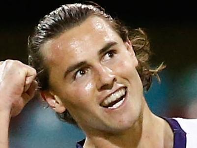 BRISBANE, AUSTRALIA - JUNE 11: Lachie Weller of the Dockers celebrates a goal during the 2016 AFL Round 12 match between the Brisbane Lions and the Fremantle Dockers at The Gabba on June 11, 2016 in Brisbane, Australia. (Photo by Adam Trafford/AFL Media/Getty Images)