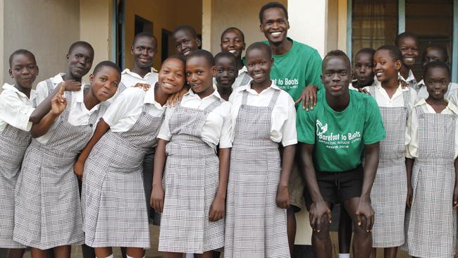 The Awer brothers with refugee schoolgirls in Kakuma. Picture: Njeri Mwangi