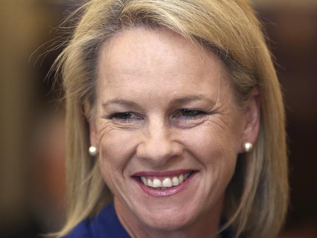 Former deputy leader of the Nationals, Fiona Nash, was not this happy when she discovered she was British by descent and therefore ineligible to sit in federal Parliament. Picture: Rob Griffith / AP