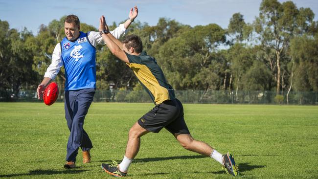 Andrew Balkwill in his light blue Carlton guernsey at Thomas More College, where he used to be principal, in 2015. Picture: Thomas More College