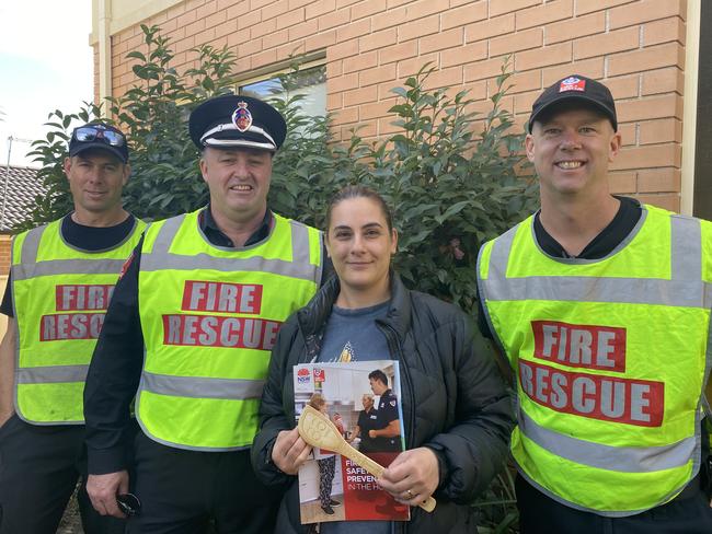 Senior Firefighter Rhett Davis, Superintendant of metropolitan South 3 zone commander Greg Wright, Station officer at Liverpool Fire Station Scott Henderson with Liverpool resident Rita Aziz.