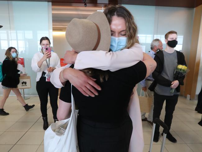 There were lots of hugs at Adelaide Airport as the first flight from Melbourne landed since the borders reopened on December 1. Picture: Tait Schmaal.