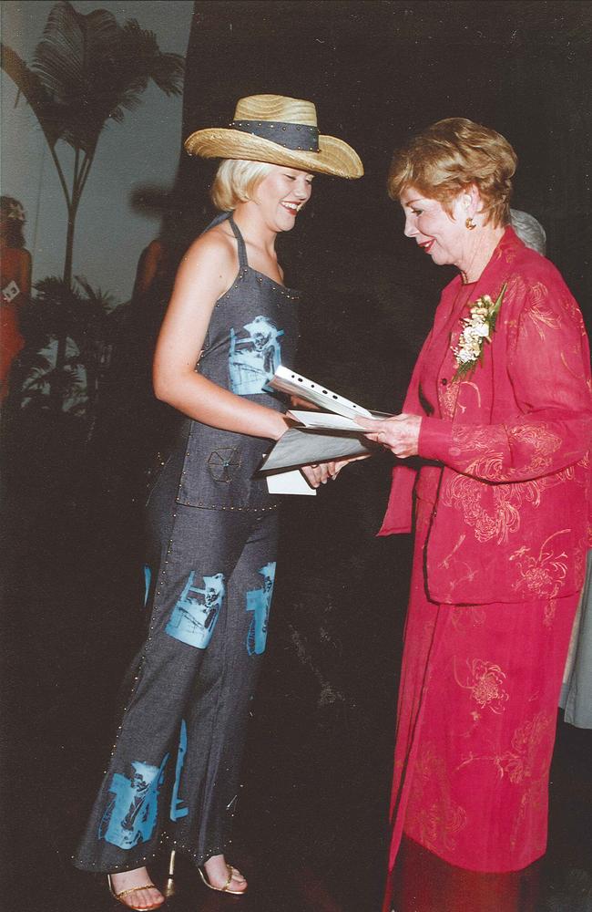 The 2001 Fashion Fantasia young designer award winner Renae Steindl is presented with her Fantasia award by then Bundaberg Mayor Kay McDuff. Submitted by Eva Anderson.