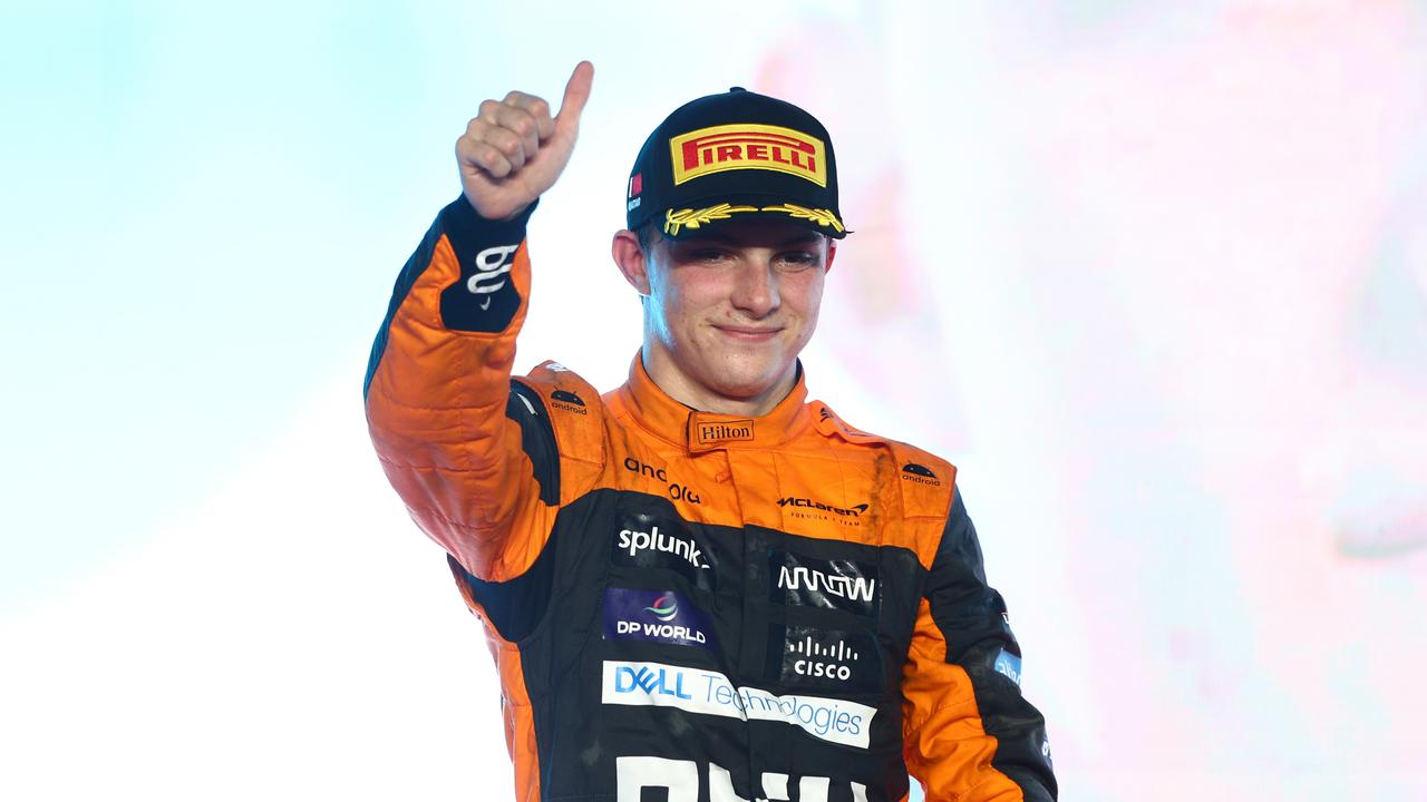 LUSAIL CITY, QATAR - OCTOBER 08: Second placed Oscar Piastri of Australia and McLaren celebrates on the podium during the F1 Grand Prix of Qatar at Lusail International Circuit on October 08, 2023 in Lusail City, Qatar. (Photo by Clive Rose/Getty Images)
