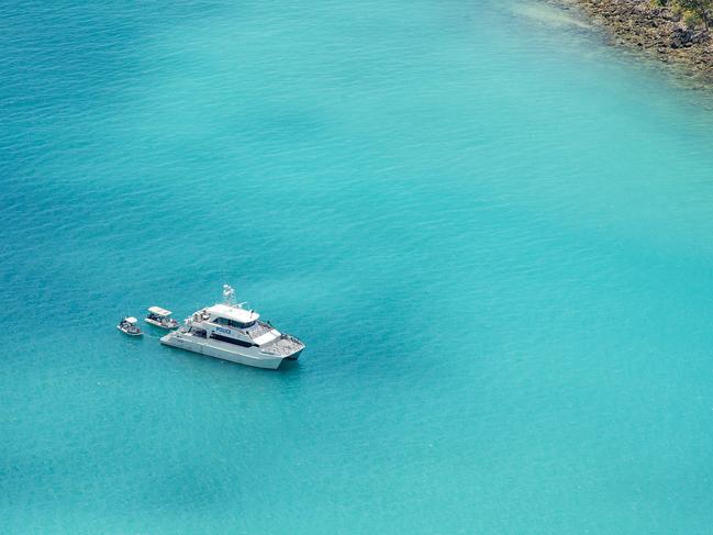 A police boat anchored in Cid Harbour, where three attacks – the most recent one fatal – have occurred in the past month. Picture: Daryl Wright