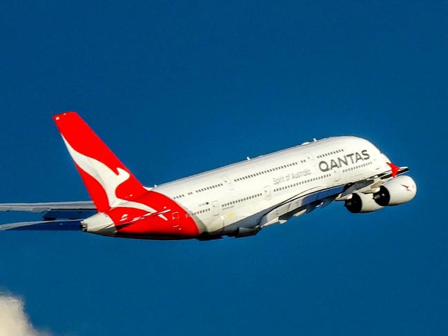 A Qantas Airbus A380-842, registration VH-OQK, has taken off to the west from Sydney Kingsford-Smith Airport and climbing above the clouds.  She is heading to Singapore as flight QF1.  This image was taken from Nigel Love Bridge off Airport Drive, Mascot on a sunny and windy afternoon on 8 April 2023.Escape 16 June 2024Why I TravelPhoto - iStock