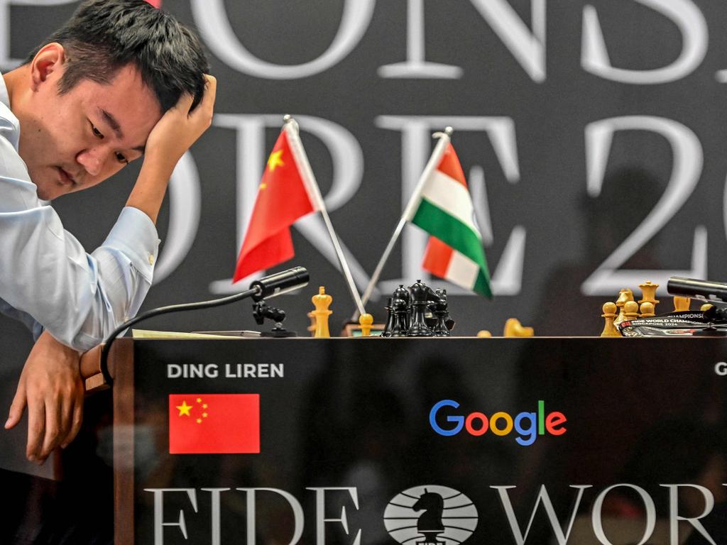 China's chess grandmaster Ding Liren reacts after losing against India's grandmaster Gukesh Dommaraju in game 14. Picture: Simon Lim / AFP