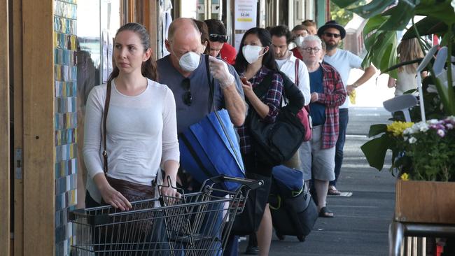 Woolworths and Coles introduced strict new customer limits in stores in a bid to enforce further social distancing measures during COVID-19. Picture: David Crosling