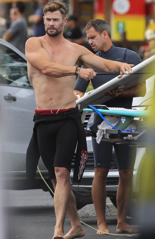 Chris Hemsworth preparing for a morning surf in Byron Bay on Tuesday. Picture: Media Mode