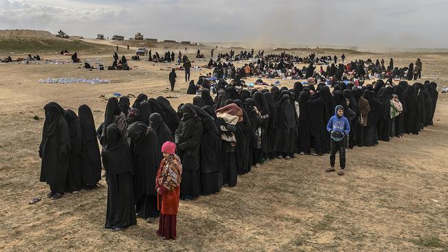 Civilians evacuated from Islamic State’s last holdout of Baghouz wait at a screening area held by the US-backed, Kurdish-led Syrian Democratic Forces in the eastern Syrian province of Deir Ezzor. Picture: AFP