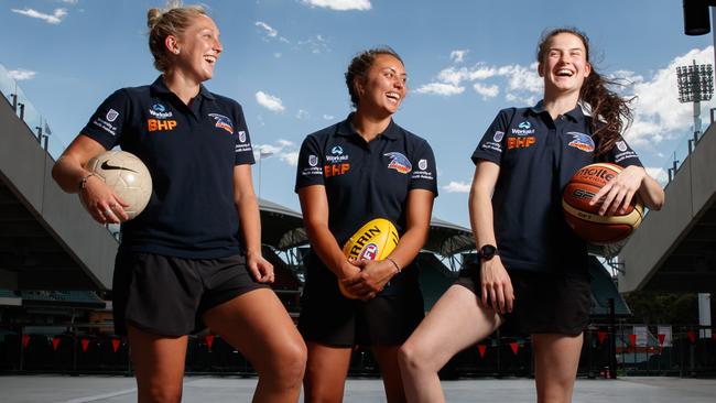 Newly drafted Crows AFLW players Marijana Rajcic (former soccer player), Ruth Wallace (soccer) and Eloise Jones (former basketballer) at the Adelaide Oval.