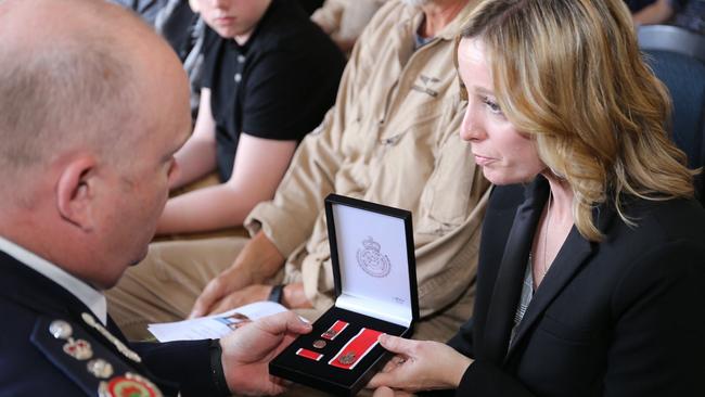 The wives of the killed fireys were given medals for their service during the memorial